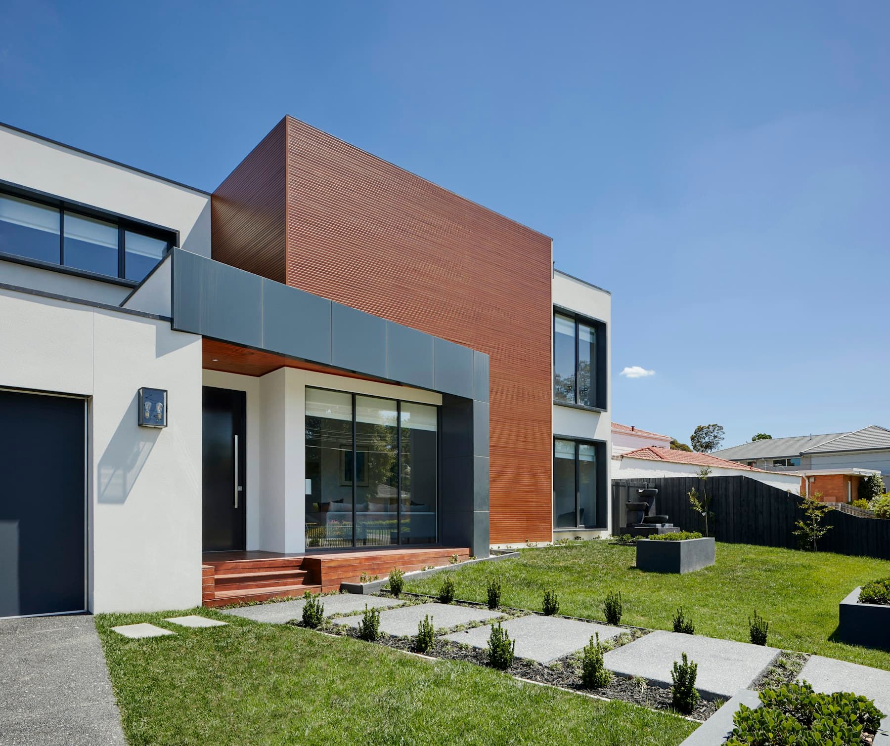 A timber-clad AYVON house seen from the street