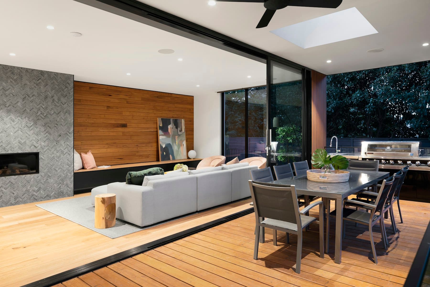 Living, dining and kitchen running as one room onto the garden