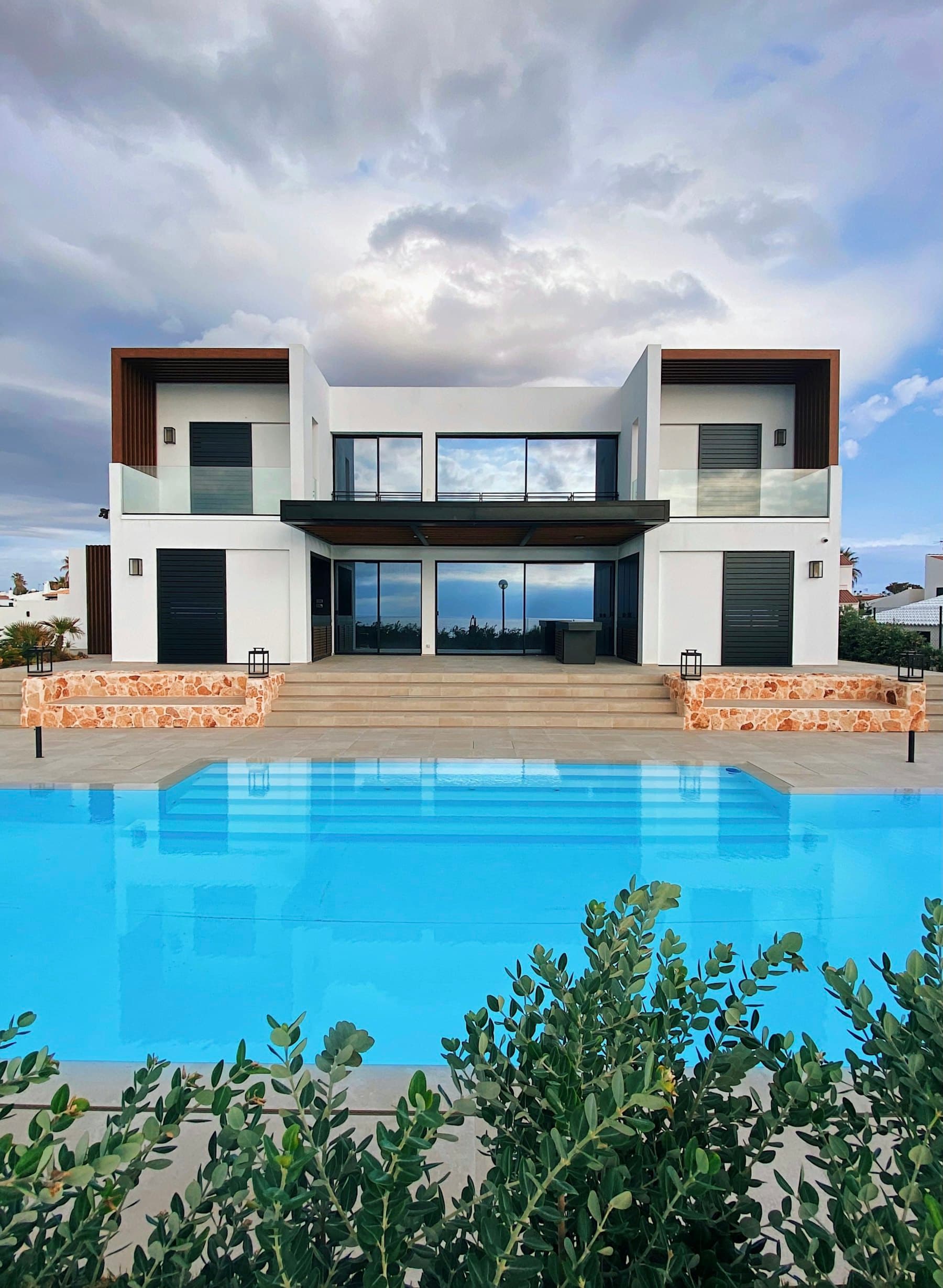 The house and the length of the pool in full sun